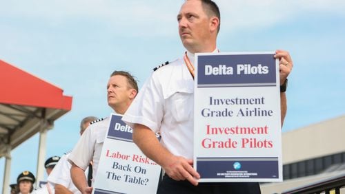 June 24, 2016 Atlanta: Delta pilots conduct informational picketing at the south terminal at Hartsfield-Jackson Atlanta International Airport on Friday morning. Delta pilots are raising awareness and urgency with Delta management for higher pay in negotiations for a new labor contract. "We are almost six months overdue for a new labor contract," said Master Executive Council (MEC) Chairman of Delta Airlines, John Malone, who has worked at Delta Airlines for 28 years. Delta pilots around the country also participated on Friday morning. EMILY JENKINS/ EJENKINS@AJC.COM