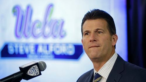 In this Oct. 12, 2017, file photo, UCLA coach Steve Alford listens to questions during the Pac-12's NCAA college basketball media day, in San Francisco. Alford will sit the three players involved in a shoplifting incident in China for Saturday's game against Georgia Tech in Shanghai. Alford, however, declined to address the issue further. (AP Photo/Eric Risberg, File)