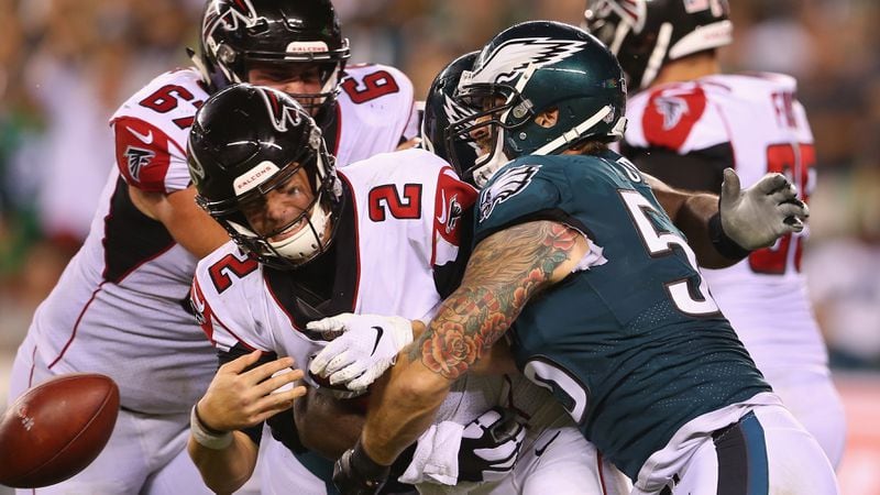 Falcons quarterback Matt Ryan fumbles the ball as he is hit by the Eagles' Chris Long during the fourth quarter Sept. 8, 2018, at Lincoln Financial Field in Philadelphia.