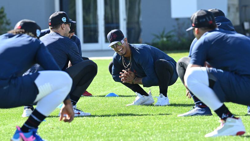 Braves second baseman Vaughn Grissom (center) smiles as he and teammates warm up during Braves spring training at CoolToday Park, Thursday, Feb. 16, 2023, in North Port, Fla.. (Hyosub Shin / Hyosub.Shin@ajc.com)