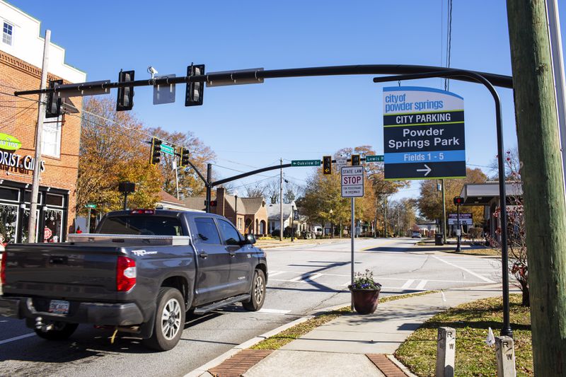 People drive through Marietta Street corridor in Powder Springs, Georgia, on Thursday, December 10, 2020. Powder Springs is embarking on a plan that would allow more businesses and mixed-used residences to possibly open in its downtown. The city's plan hopes to promote growth and redevelopment while maintaining its small-town charm and atmosphere. (Rebecca Wright for the Atlanta Journal-Constitution)  