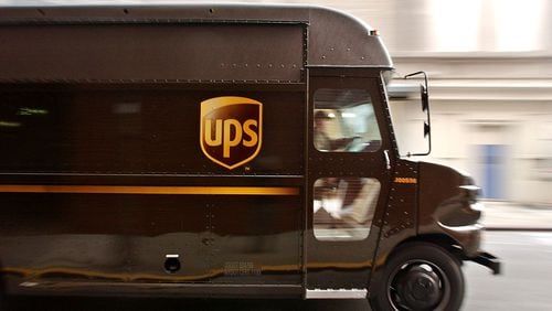 NEW YORK - DECEMBER 23: A delivery truck makes its way out of the 43rd Street United Parcel Service (UPS) depot December 23, 2003 in New York City. UPS, which averages about 13 million packages per day during the holiday season, will ship more than 300 million packages this holiday season.
