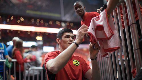 Atlanta Hawks forward Ersan Ilyasova signs autographs for fans before an NBA game against the Denver Nuggets at Philips Arena, Friday, Oct. 27, 2017, in Atlanta.  BRANDEN CAMP/SPECIAL