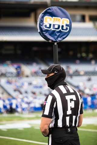A referee stands on the sidelines. CHRISTINA MATACOTTA FOR THE ATLANTA JOURNAL-CONSTITUTION