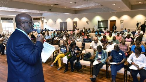 Dwight Robinson, chief appraiser, speaks before Fulton County residents during Emergency Town Hall Meeting to discuss Property Tax Assessments hosted by Fulton County Office of Chairman John Eaves at Harriett G. Darnell Senior Multipurpose Facility on Tuesday, June 13, 2017. Eaves and the other commissioners voted Wednesday to return the values to 2016 levels. HYOSUB SHIN / HSHIN@AJC.COM