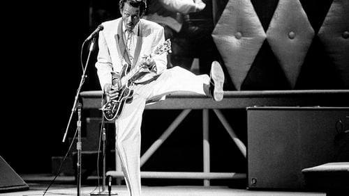 In this Oct. 17, 1986 file photo, Chuck Berry performs during a concert celebration for his 60th birthday at the Fox Theatre in St. Louis, Mo. On Saturday, March 18, 2017, police in Missouri said Berry has died at the age of 90. (AP Photo/James A. Finley)