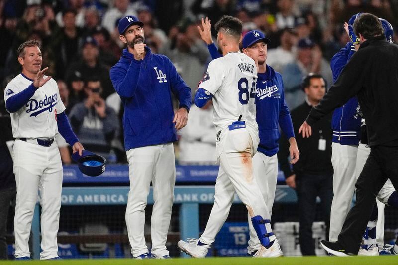 Los Angeles Dodgers' Andy Pages (84) leaves the field after a walk-off single during the eleventh inning of a baseball game against the Atlanta Braves in Los Angeles, Friday, May 3, 2024. Will Smith scored. The Dodgers won 4-3. (AP Photo/Ashley Landis)