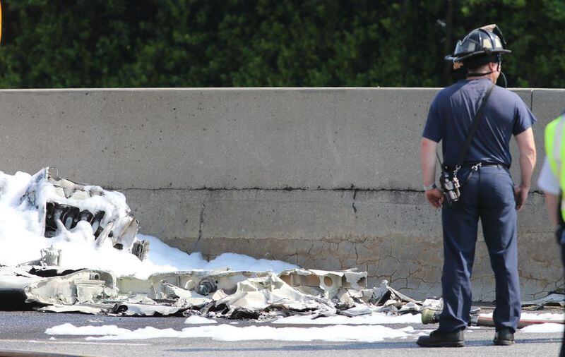 Four people have died after a small plane crashed Friday morning at I-285 at Peachtree Industrial Boulevard. The fire was extinguished, but there was very little wreckage left. Traffic was shut down in both directions. AJC photo: John Spink