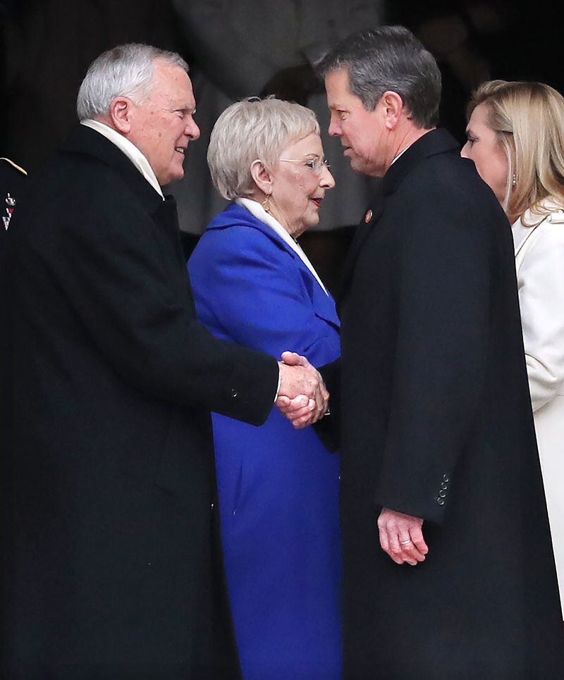 Incoming Gov. Brian Kemp and outgoing Gov. Nathan Deal shake hands during a ceremonial send-off at the Georgia State Capitol after Kemp was sworn-in on Monday, Jan. 14, 2019, in Atlanta. 