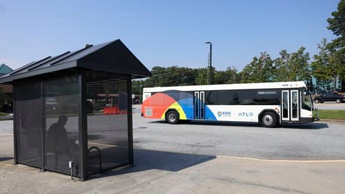 A Ride Gwinnett bus picks-up passengers at the Gwinnett County Transit Center off of Satellite Boulevard, Tuesday, September 12, 2023, in Duluth, Ga. (Jason Getz / Jason.Getz@ajc.com)