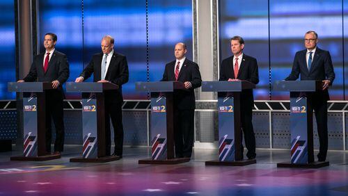 Republican candidates for governor Michael Williams, from left, Clay Tippins, Hunter Hill, Brian Kemp, and Casey Cagle wait for the start of the Atlanta Journal-Constitution, Channel 2 Action News and WSB Radio debate, Sunday, May 20, 2018, in Atlanta. BRANDEN CAMP/SPECIAL