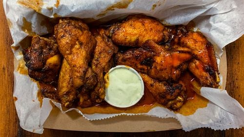 The Local, a dive bar on Ponce known for its karaoke, has three sections on its menu: wings, hot dogs and tacos. The wings take top billing for a reason. CONTRIBUTED BY HENRI HOLLIS