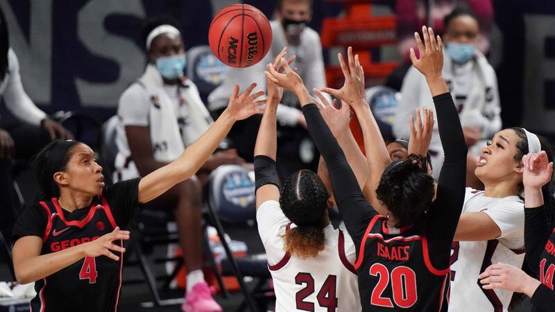 Georgia guard Mikayla Coombs (4) and Jordan Isaacs (20) battle for a rebound against South Carolina guard LeLe Grissett (24) and Brea Beal (right) during the second half of the SEC Tournament championship game Sunday, March 7, 2021, in Greenville, S.C. (Sean Rayford/AP)