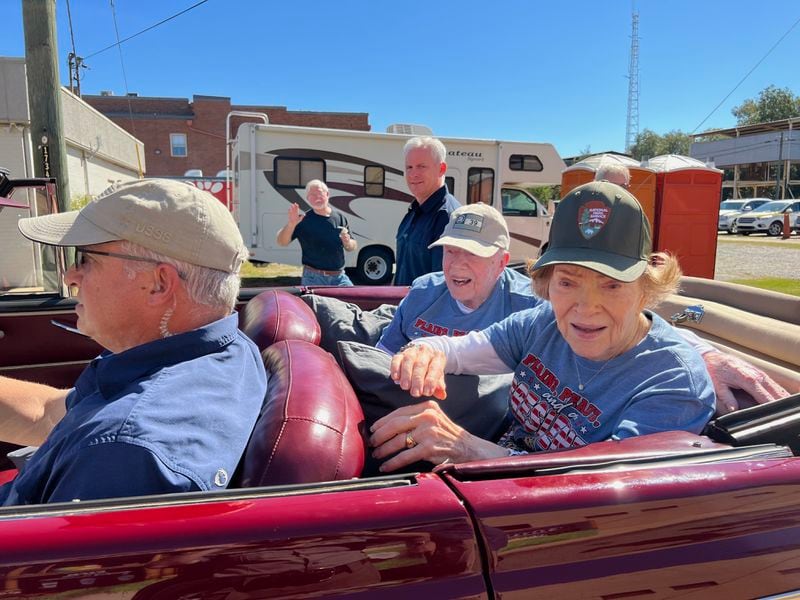 Former President Jimmy Carter and former First Lady Rosalynn Carter make their way through Plains for the annual Peanut Festival.