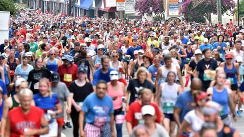Runners make their way down Peachtree Road during the 50th AJC Peachtree Road Race on Thursday, July 4, 2019, in Atlanta.