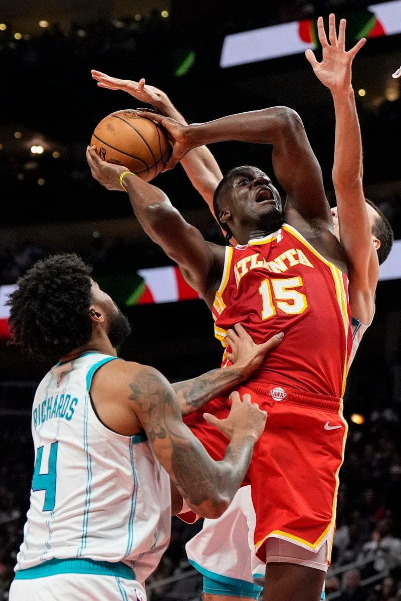 Atlanta Hawks center Clint Capela (15) shoots against Charlotte Hornets center Nick Richards (4) during the second half of an NBA basketball game, Wednesday, April 10, 2024, in Atlanta. (AP Photo/Mike Stewart)