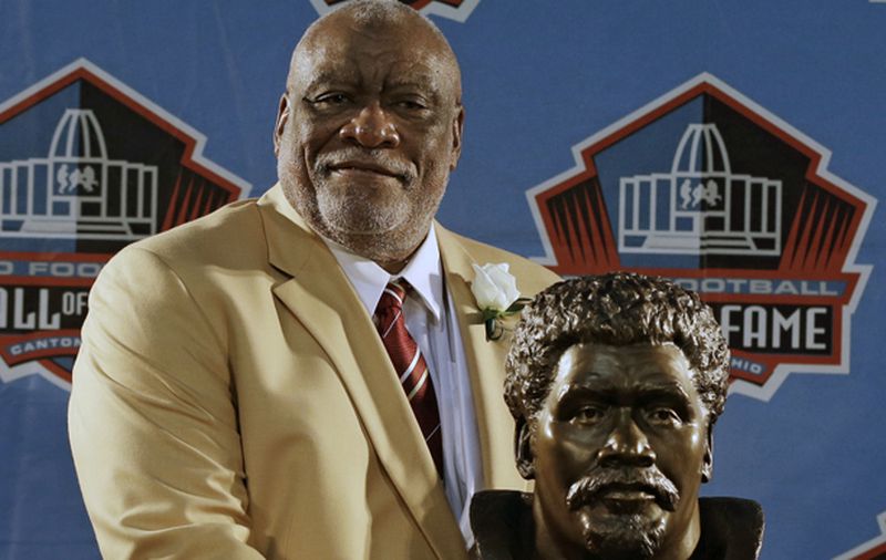 Hall of Fame Inductee Claude Humphrey poses with his bust during the 2014 Pro Football Hall of Fame Enshrinement Ceremony at the Pro Football Hall of Fame Saturday, Aug. 2, 2014, in Canton, Ohio. (AP Photo/Tony Dejak)