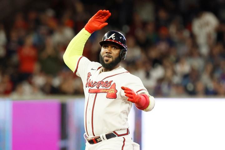 Atlanta Braves designated hitter Marcell Ozuna (20) gestures to the dugout after hitting a double during the fourth inning of a baseball game against the New York Mets at Truist Park on Saturday, Oct. 1, 2022. Miguel Martinez / miguel.martinezjimenez@ajc.com