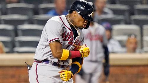 Braves outfielder Ronald Acuna reacts while crossing the plate after hitting a solo home run during the fifth inning of the second game of a doubleheader against the New York Mets, Monday, June 21, 2021, in New York. (Kathy Willens/AP)