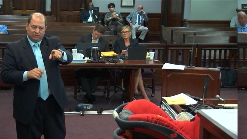 Defense lawyers for Justin Ross Harris ask Cobb County detective Carey Grimstead how he took measurements inside Harris' SUV, during Harris' murder trial at the Glynn County Courthouse in Brunswick, Ga., on Wednesday, Oct. 12, 2016. (screen capture via WSB-TV)
