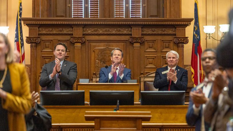 Georgia's top leaders at the Capitol, Gov. Brian Kemp, center, Lt. Gov. Burt Jones, left, and Speaker Jon Burns are stressing action during this year's legislative session on issues such as economic development. They are not pushing social issues, such as abortion. (Arvin Temkar / arvin.temkar@ajc.com)