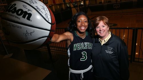 Mikayla Coombs (left) and her basketball coach Jan Azar (right) of Weslayan School pose for a portrait at Wesleyan School on May 8, 2017. Coombs will attend the University of Connecticut on a basketball scholarship. While her school was the Class A state champions, she was named Miss Georgia Basketball and will also be trying out for the U.S. U-19 team, which narrows down to twelve players and the try-outs are invite only. (HENRY TAYLOR / HENRY.TAYLOR@AJC.COM)