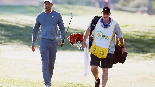 SCOTTSDALE, AZ - JANUARY 28: Tiger Woods walks with his caddie Joe LaCava to a green during the pro-am prior to the start of the Waste Management Phoenix Open at TPC Scottsdale on January 28, 2015 in Scottsdale, Arizona. (Photo by Scott Halleran/Getty Images) Tiger Woods walks with caddie Joe LaCava to a green during Wednesday's pro-am prior to the Phoenix Open. (Getty Images)