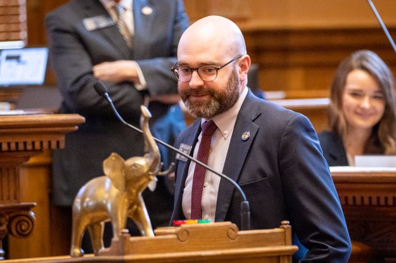 State Sen. Josh McLaurin, D-Sandy Springs, accepts the Golden Elephant Award, which was jokingly awarded to him at the Capitol in Atlanta on Monday.