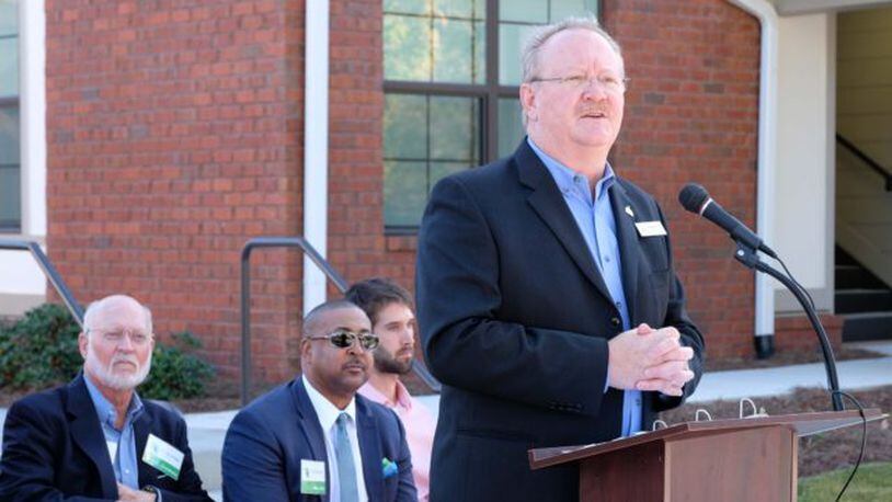 Decatur Housing Authority Executive Director Doug Faust speaking during the dedication of Trinity Walk. Photo by Judith Vanderver