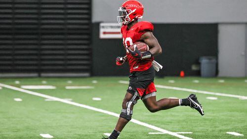 The ability of Georgia wide receiver Kearis Jackson (10), running in practice on Monday, to recover from an arthroscopic procedure on his right knee (note brace) will be paramount to the Bulldogs' passing game against Clemson in the season opener on Sept. 4 in Charlotte. (Photo by Mackenzie Miles/UGA Athletics)