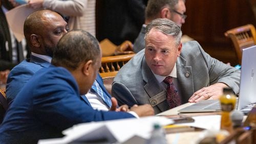 Today is the final day of the legislative session in Georgia. State Rep. Derrick McCollum, R-Chestnut Mountain, (right) is recently seen in discussion at the House of Representatives in Atlanta. (Arvin Temkar/The Atlanta Journal-Constitution)