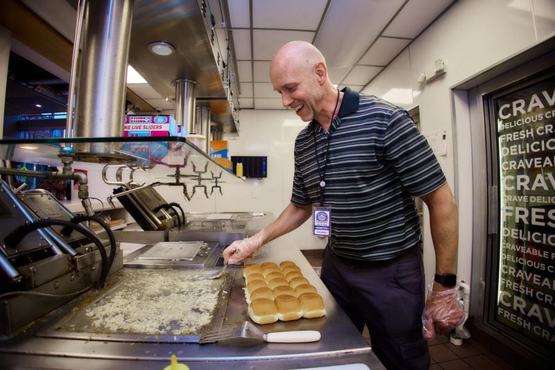 Marietta resident Ken Oberle prepares sliders at the White Castle Cravers Hall of Fame induction festivities in May. One of Oberle's first jobs was working at White Castle, and he has been a fan of the burger joint his entire life. Courtesy of White Castle