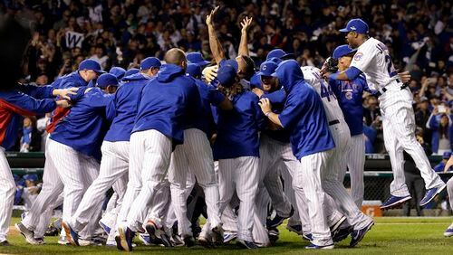 FILE - In this Oct. 13, 2015, file photo, Chicago Cubs players celebrate after winning Game 4 in baseball's National League Division Series, in Chicago. The Cubs look about as locked and loaded as any team after a 97-win season that catapulted them to the NLCS and sparked hope among their long-suffering fans that a championship drought dating to 1908 just might be in its final stages. (AP Photo/Nam Y. Huh)