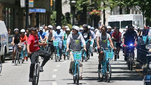 Bike riders take to the streets on an escorted ride downtown as part of a launch of the city’s new bike share system, which included a program of speakers an a two mile bike ride around downtown. (BOB ANDRES / BANDRES@AJC.COM)