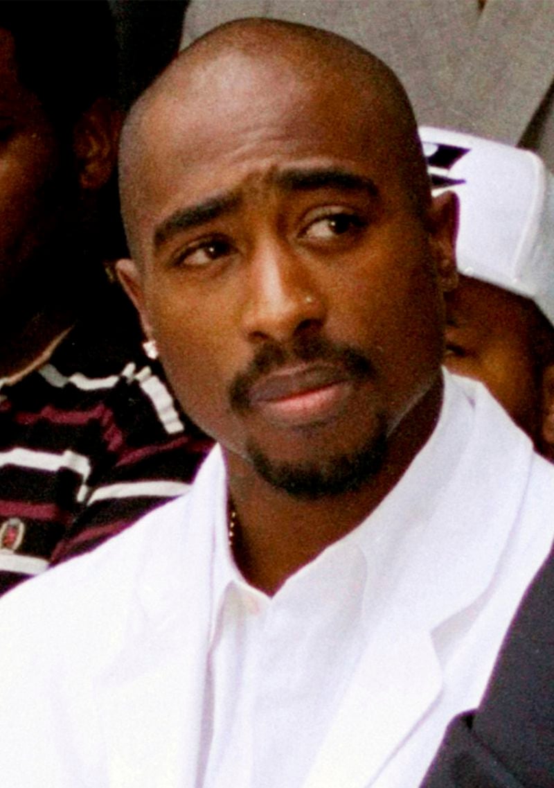 FILE - Rapper Tupac Shakur attends a voter registration event in South Central Los Angeles, Aug. 15, 1996. The defense attorney representing a former Los Angeles-area gang leader accused of killing hip-hop music icon Tupac Shakur in 1996, in Las Vegas, said Tuesday, April 23, 2024, his client's accounts of the killing are fiction and prosecutors lack key evidence to obtain a murder conviction. (AP Photo/Frank Wiese, File)