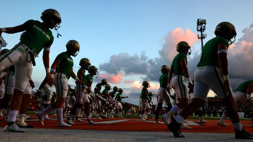 Buford football players warm up before their game against North Cobb at North Cobb high school Friday, August 20, 2021 in Kennesaw, Ga.