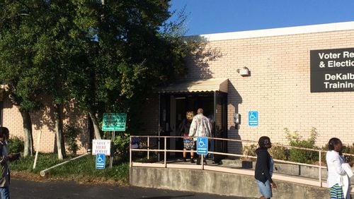 People walk into the DeKalb County elections office Monday to vote. JOSHUA.SHARPE/JOSHUA.SHARPE@AJC.COM