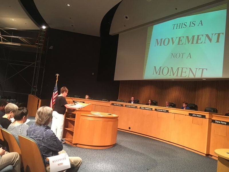 Protester Susan Clymer speaks during the Tuesday night meeting in which Gwinnett's Board of Commissioners voted to publicly reprimand colleague Tommy Hunter.