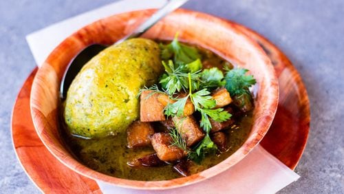 The off-menu mofongo at El Super Pan is served with a green sofrito-based sauce and cubes of pork belly. CONTRIBUTED BY HENRI HOLLIS