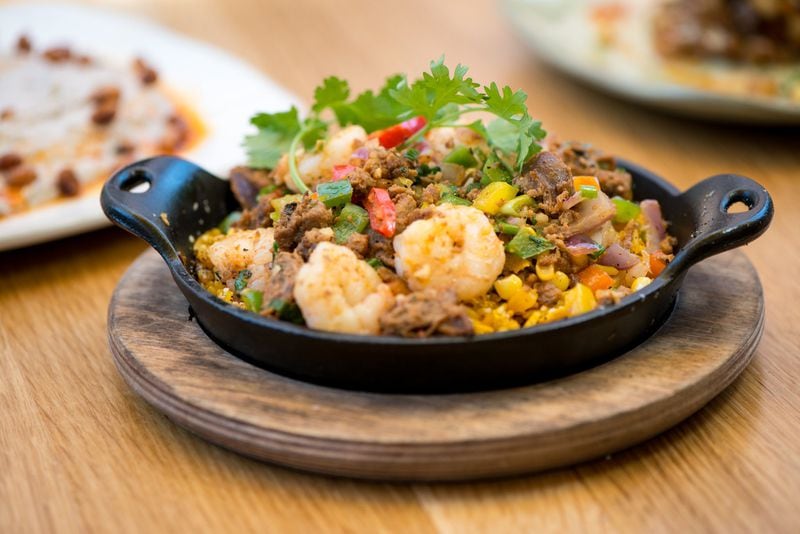  Shrimp and Chorizo Skillet with Gulf shrimp, chorizo, crispy rice, and tri-pepper hash. Photo credit- Mia Yakel.