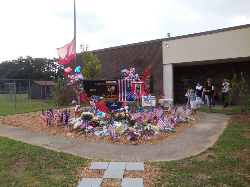 A memorial to Sprayberry High School alum USMC Lance Cpl. Skip Wells, killed on his first day of duty in Chattanooga last week. Photo: Jennifer Brett