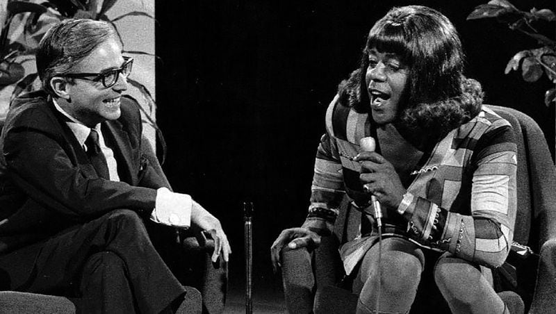 In this 1971 publicity photo from “The Flip Wilson Show,” Wilson gets into character as “Geraldine” to interview Dr. David Reuben. CONTRIBUTED BY NBC TELEVISION