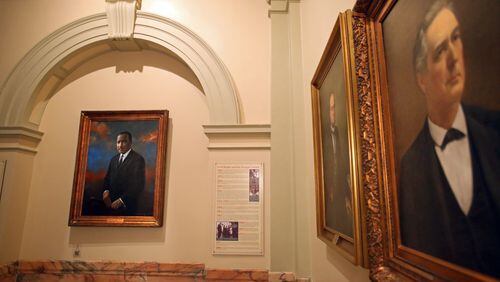 [The Capitol Quiz is a photo gallery/quiz of unique things at the Georgia State Capitol for the legislative page.] February 13, 2013 - Atlanta, Ga: A portrait of Martin Luther King, Jr. is shown next to portraits of former Georgia Governors Wednesday afternoon in Atlanta, Ga., February 13, 2013. Martin Luther King Jr. Portrait: On the second story of the Georgia State Capitol, the portrait of Dr. Martin Luther King, Jr. is the only non-governor on the Governor's Wall. All of the other portraits are former Governors. He grew up less than two miles away from the Capitol on Auburn Avenue and went to school at Morehouse College. It is not known if Dr. King ever entered the Capitol. During most of his life African-Americans could not freely enter the Capitol. He spent his adult life fighting against this kind of discrimination and by the time of his death in 1968, 10 African Americans were serving in Georgia's General Assembly. In 1974, Jimmy Carter brought in a portrait of Dr. Martin Luther King. JASON GETZ / JGETZ@AJC.COM