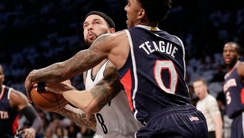 Atlanta Hawks' Jeff Teague, right, defends Brooklyn Nets' Deron Williams during the first half of Game 6 in a first round NBA playoff basketball game Friday, May 1, 2015, in New York. (AP Photo/Frank Franklin II) Jeff Teague keyed Hawks' win with defense like this against Brooklyn's Deron Williams. (AP photo)