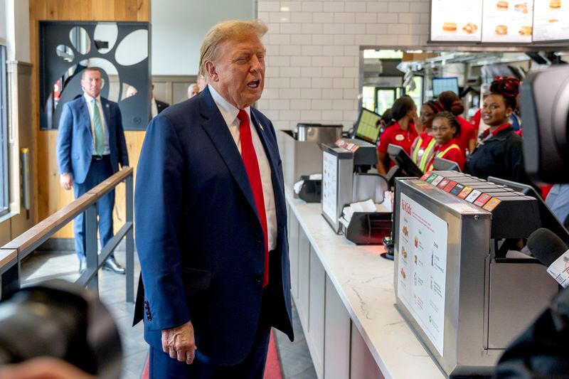 FILE - Republican presidential candidate former President Donald Trump visits a Chick-fil-A eatery, April 10, 2024, in Atlanta. Five months before the first general election votes are cast, Trump's campaign has little to show for its ambitious minority outreach plan. Trump advisers point to Trump's appearances at the eatery, as well as a New York bodega and a New York City police officer's wake as examples of the campaign's developing outreach strategy that hinges on using Trump's celebrity and bombastic personality to create viral moments in communities of color. (AP Photo/Jason Allen, File)