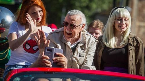 Dragon Con's Grand Marshal Stan Lee waves to the crowd as he makes his way up Peachtree Street during the Dragon Con parade Saturday, September 2, 2017. Lee was formerly editor-in-chief of Marvel Comics. STEVE SCHAEFER / SPECIAL TO THE AJC