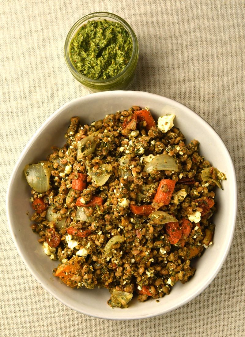 Carrot tops are a key ingredient in the pesto for Pecan Pesto Grain Salad. (Styling by Taylor Mead / Chris Hunt for the AJC)