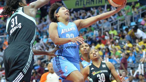 Atlanta Dream guard Layshia Clarendon (23) goes in for a lay-up past New York Liberty center Tina Charles (31) in Atlanta Dream 90 - 79 loss to the New York Liberty after two extra periods at Philips Arena on Wednesday, June 22, 2016. HYOSUB SHIN / HSHIN@AJC.COM