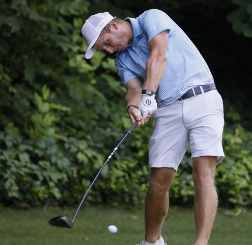 Carson Bacha, from Auburn University, who finished first, hits from the fifth tee during the final round of the Dogwood Invitational Golf Tournament in Atlanta on Saturday, June 11, 2022.   (Bob Andres for the Atlanta Journal Constitution)