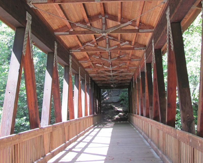 A covered bridge is one of the cool structures on the Vickery Creek Trail.